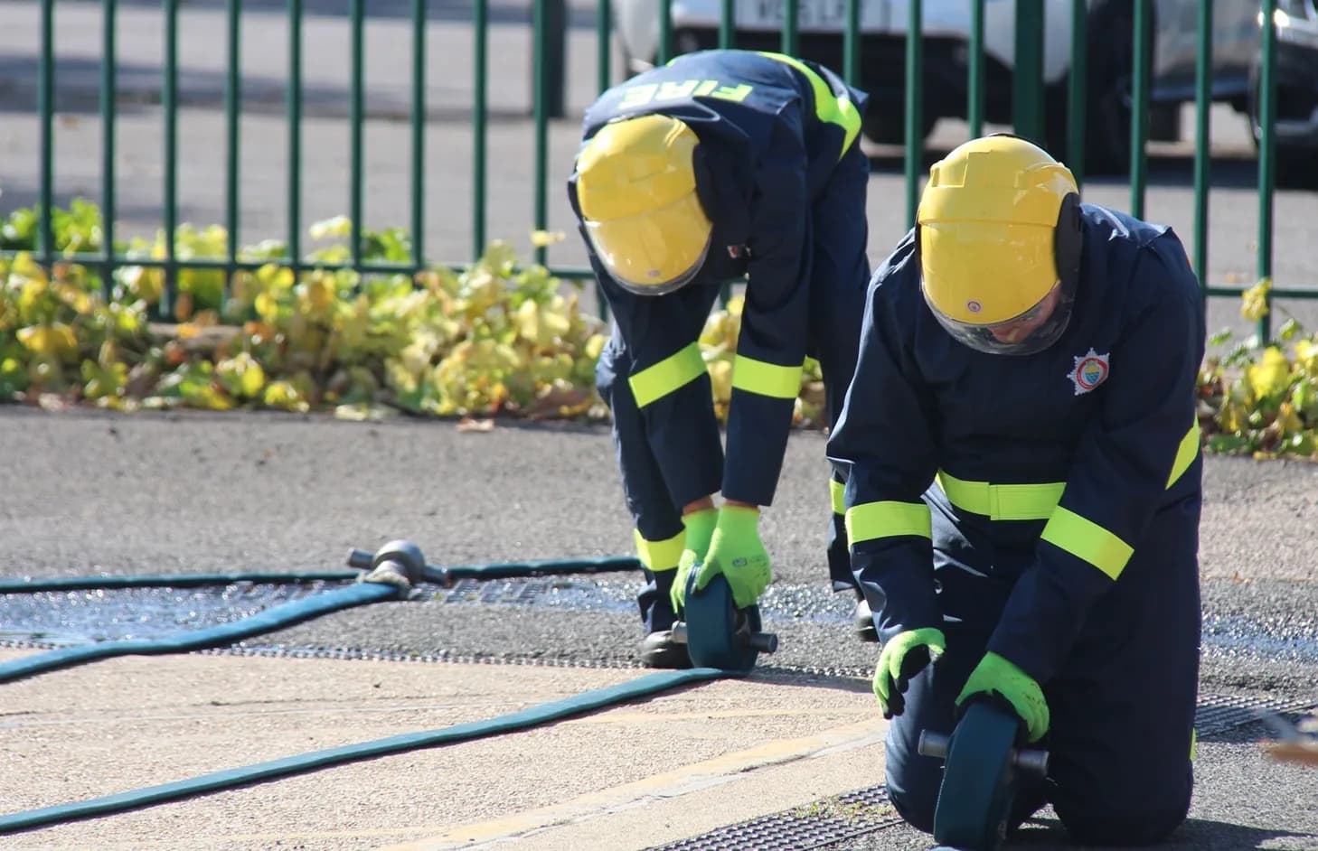 Students running hose after the drill had finished.